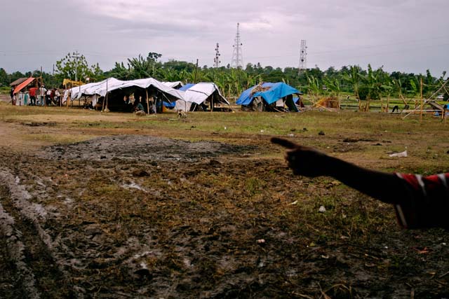 Makeshift tents are set up in the muddy surroundings of a warehouse in Pikit, North Cotabato for evacuees to take refuge in. People numbering in the hundreds of thousands (half a million, by one estimate) were displaced from their homes in Central Mindanao by armed clashes between the Armed Forces of the Philippines and Moro Islamic Liberation Front forces last August. Locally called "bakwits" (from "evacuate," it is a colloquial term for evacuees), they were forced to endure inhospitable conditions in makeshift evacuation centers, where they faced hunger, unsanitary environs, an unforgiving weather, and uncertainty.